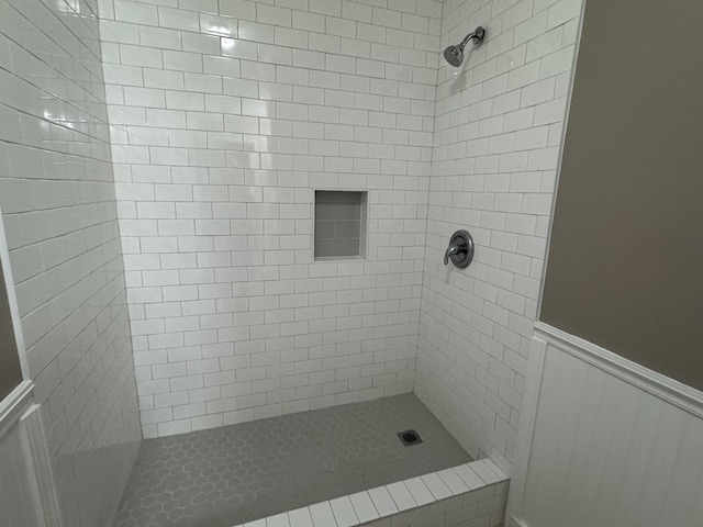 bathroom with a tile shower