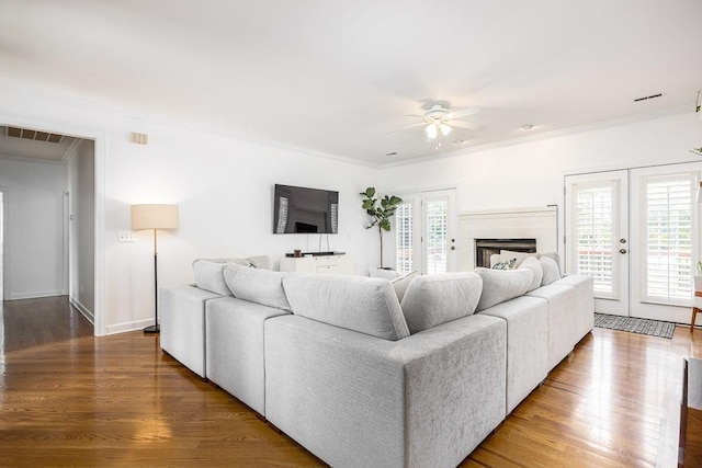 living room featuring crown molding and french doors