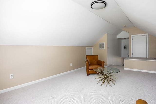 living area with carpet flooring and lofted ceiling