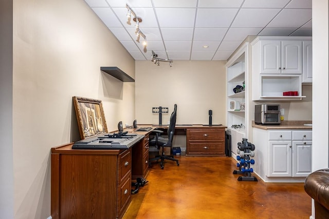 office with a paneled ceiling