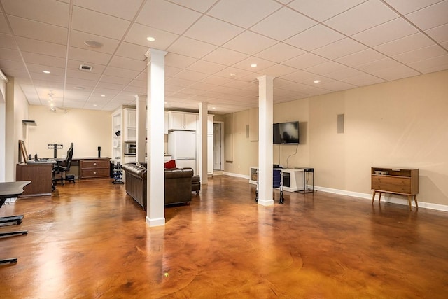 interior space with a paneled ceiling