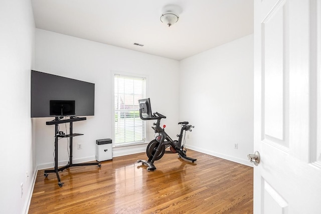 exercise area with wood-type flooring