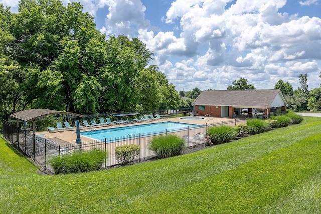 view of swimming pool with a lawn and a patio area