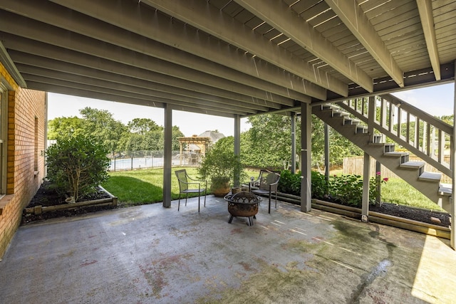 view of patio / terrace featuring a fire pit