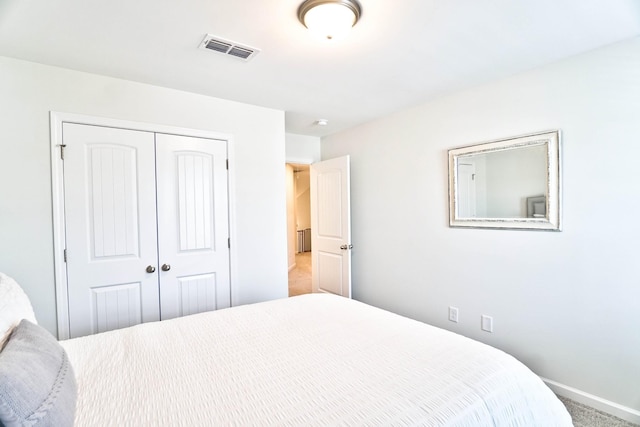 carpeted bedroom featuring a closet