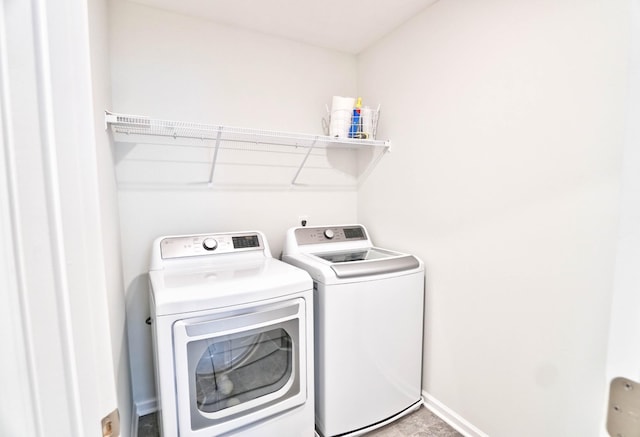 clothes washing area featuring washing machine and dryer