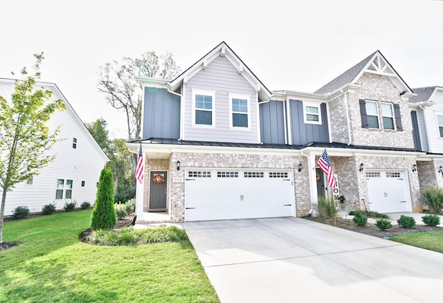 townhome / multi-family property featuring a garage and a front yard