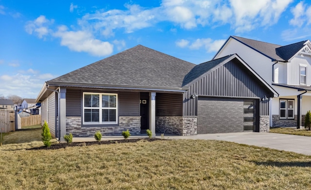 view of front of property featuring a garage and a front lawn