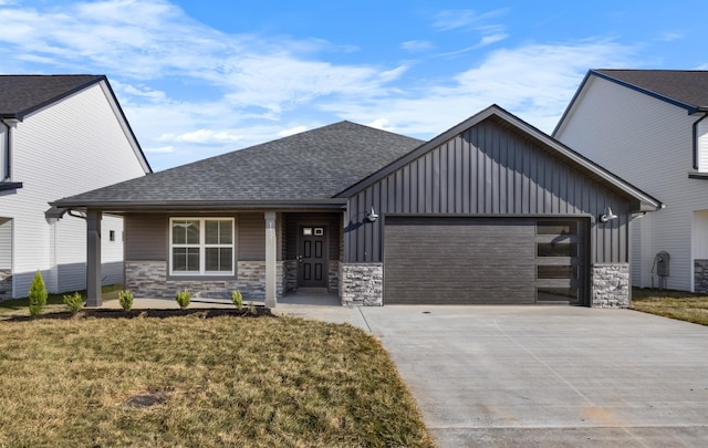 view of front of home with a front lawn and a garage