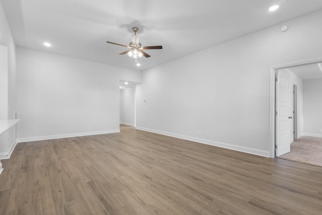 unfurnished room featuring ceiling fan and hardwood / wood-style floors