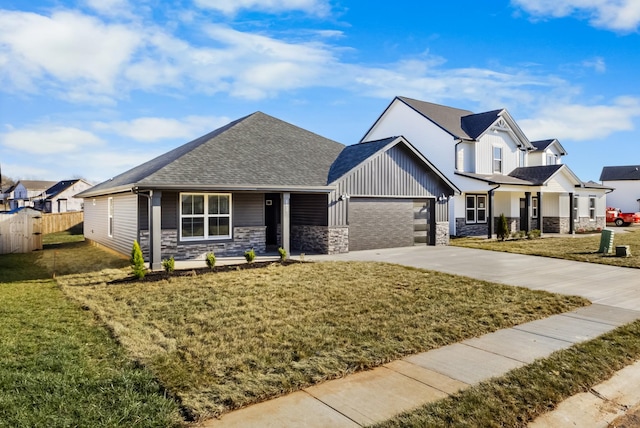 view of front of house with a front yard and a garage