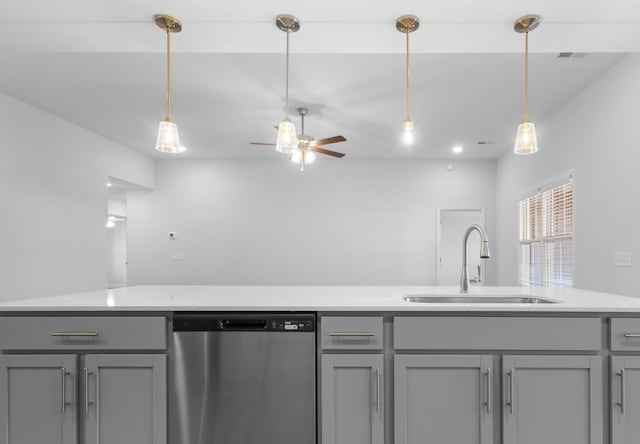 kitchen with stainless steel dishwasher, sink, ceiling fan, and gray cabinetry