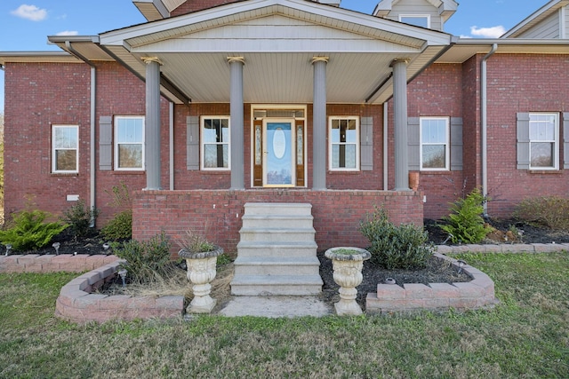 entrance to property featuring a porch