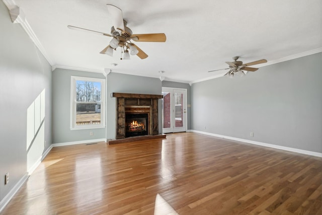 unfurnished living room with hardwood / wood-style floors, ceiling fan, and ornamental molding