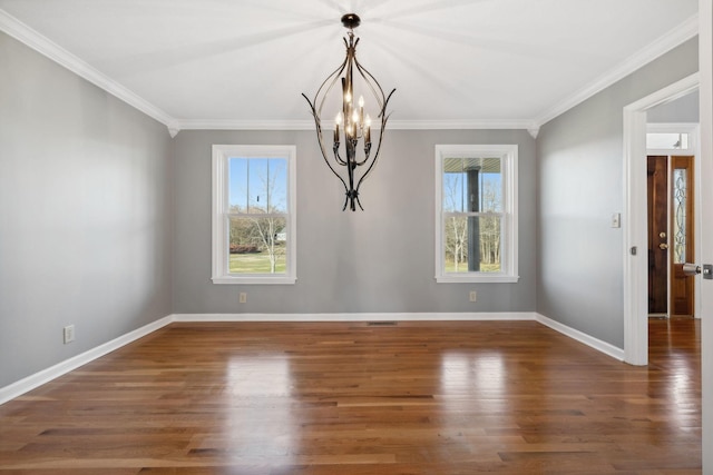 unfurnished dining area featuring a notable chandelier, crown molding, and dark wood-type flooring