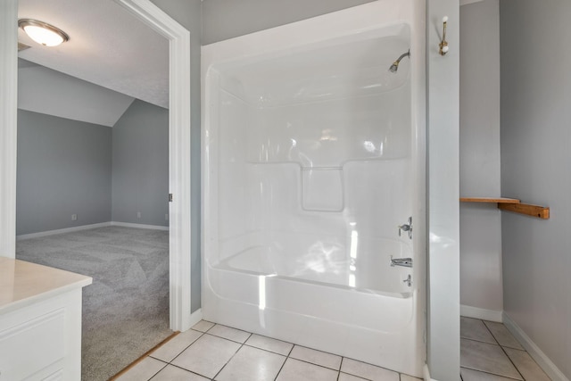 bathroom with tile patterned flooring, vanity, and shower / washtub combination