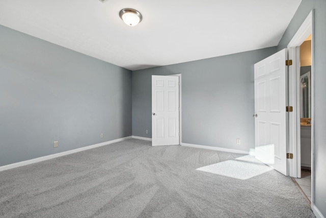 unfurnished bedroom featuring light colored carpet