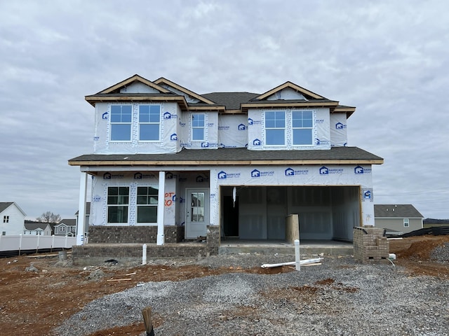 property in mid-construction with a garage