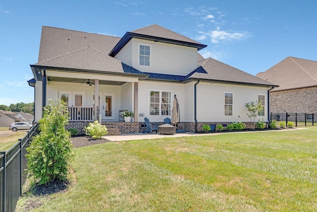 back of house with a yard, a patio, and ceiling fan