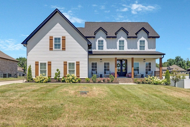 view of front of house featuring a porch and a front lawn