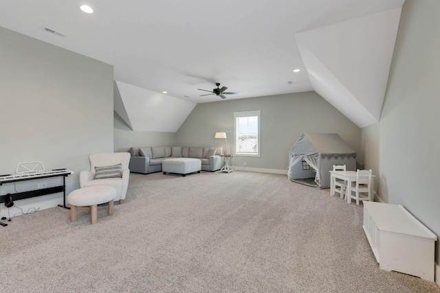 interior space with light carpet, ceiling fan, and vaulted ceiling