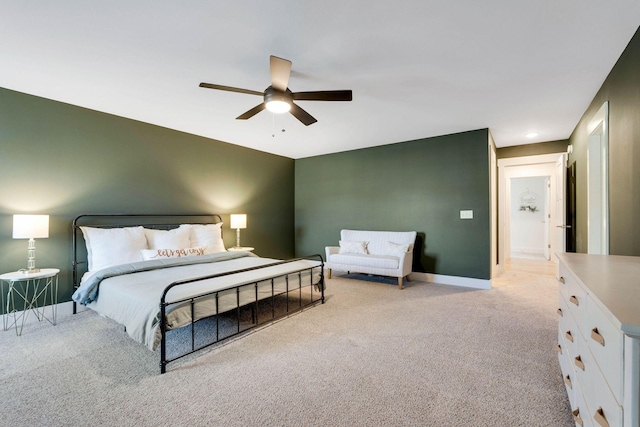 bedroom with ceiling fan and light colored carpet