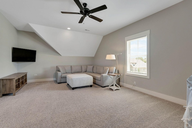 carpeted living room with vaulted ceiling and ceiling fan