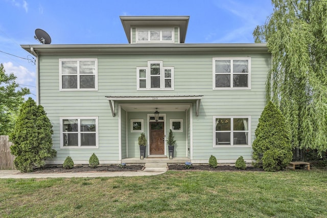 view of front of property with a front lawn