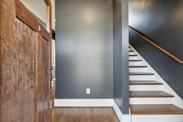 staircase featuring hardwood / wood-style floors