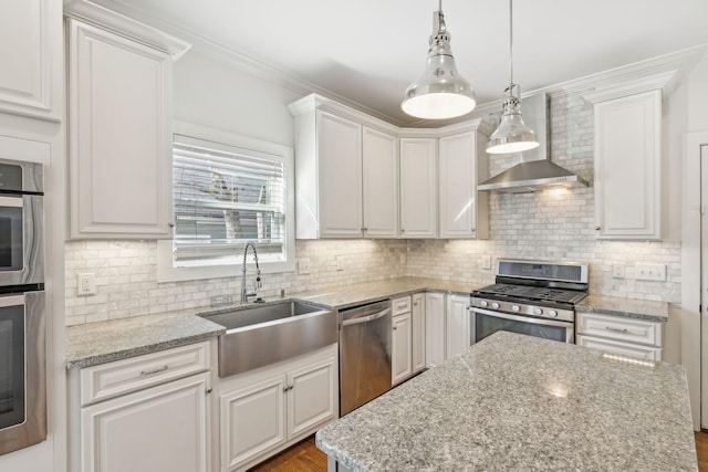 kitchen with white cabinets, appliances with stainless steel finishes, pendant lighting, and sink