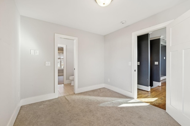 spare room with light colored carpet