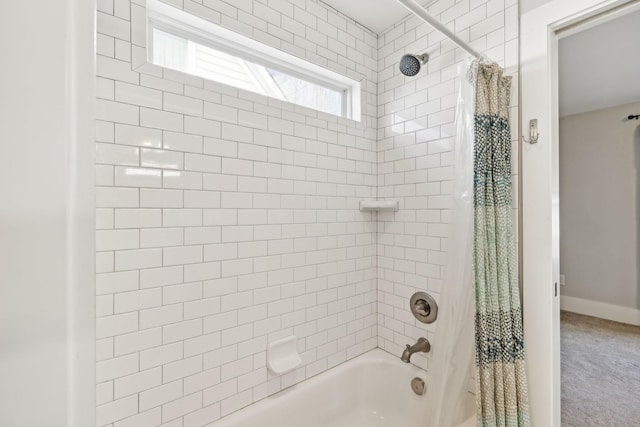 bathroom with shower / tub combo with curtain