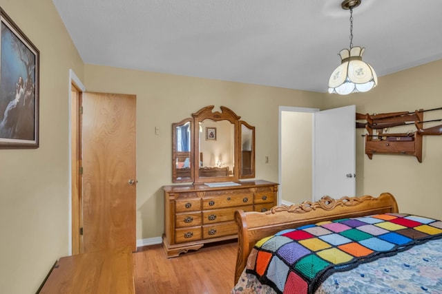 bedroom with hardwood / wood-style floors