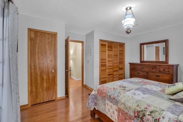 bedroom featuring a closet and light hardwood / wood-style flooring