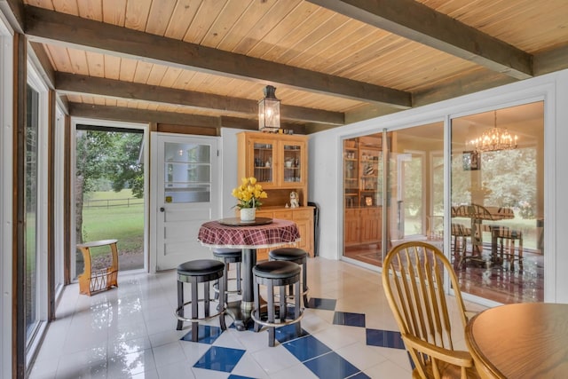 tiled dining space with an inviting chandelier, beamed ceiling, and wood ceiling