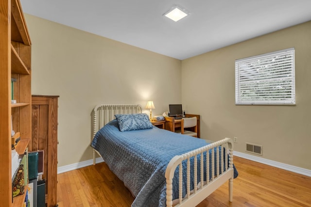 bedroom featuring hardwood / wood-style floors