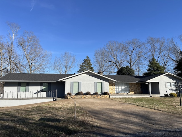 ranch-style home with a front yard