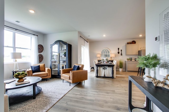 living room with light hardwood / wood-style floors