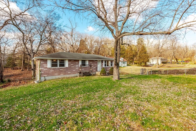 view of front of home featuring a front lawn