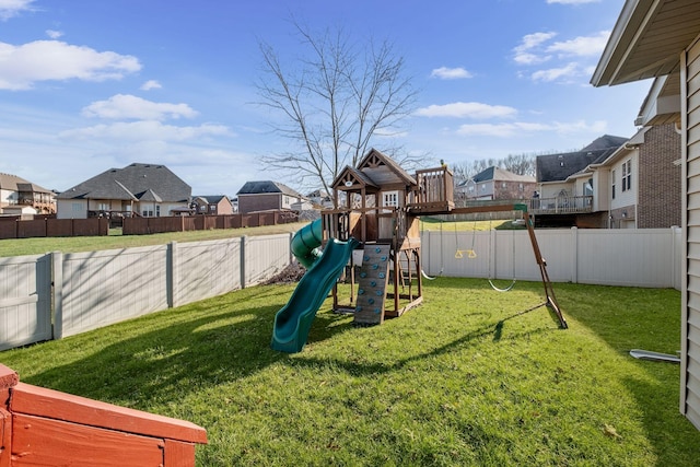 view of playground with a lawn