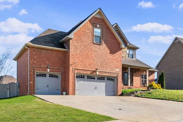 front facade featuring a front lawn and a garage