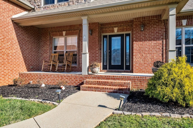 property entrance featuring a porch