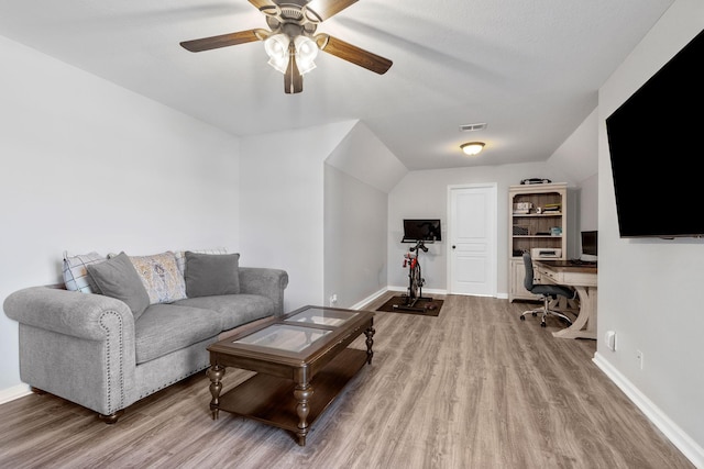 living room with ceiling fan and hardwood / wood-style flooring