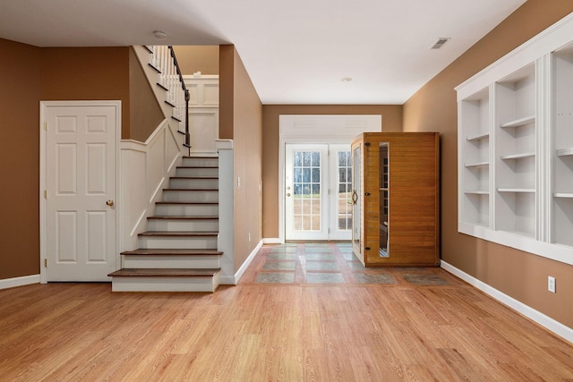 entryway with light hardwood / wood-style flooring