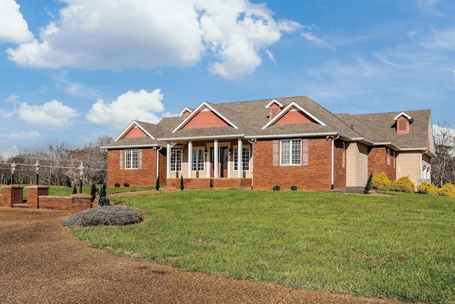 craftsman-style house with covered porch and a front yard