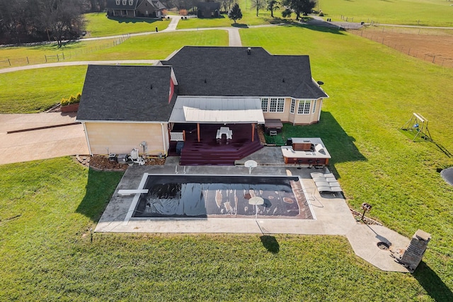 birds eye view of property with a rural view