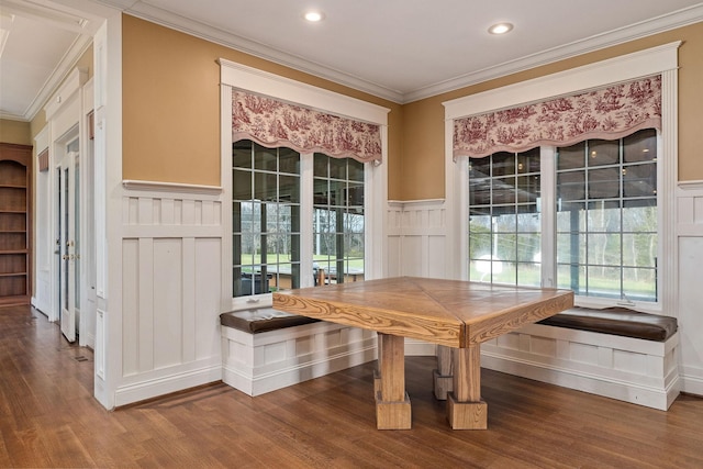 unfurnished dining area with breakfast area, wood-type flooring, and crown molding