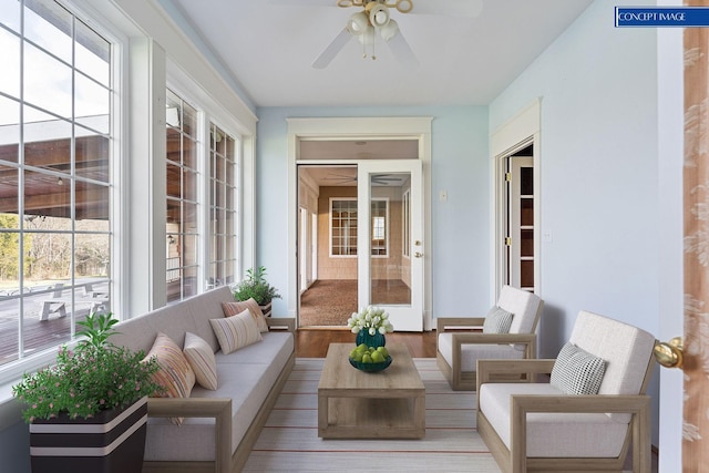 sunroom / solarium featuring ceiling fan