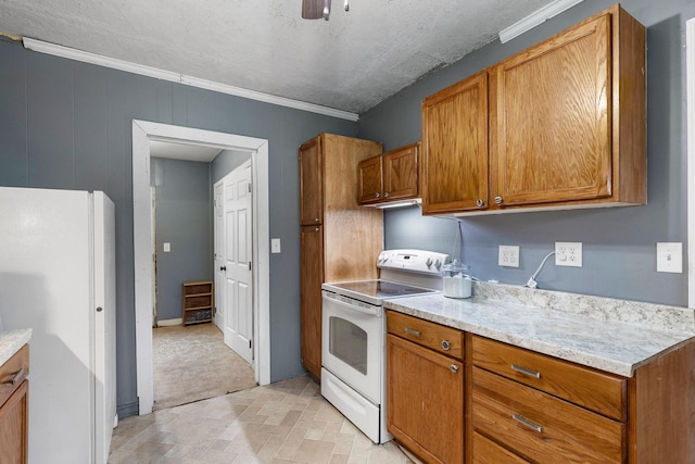 kitchen featuring white appliances, crown molding, ceiling fan, a textured ceiling, and light stone counters