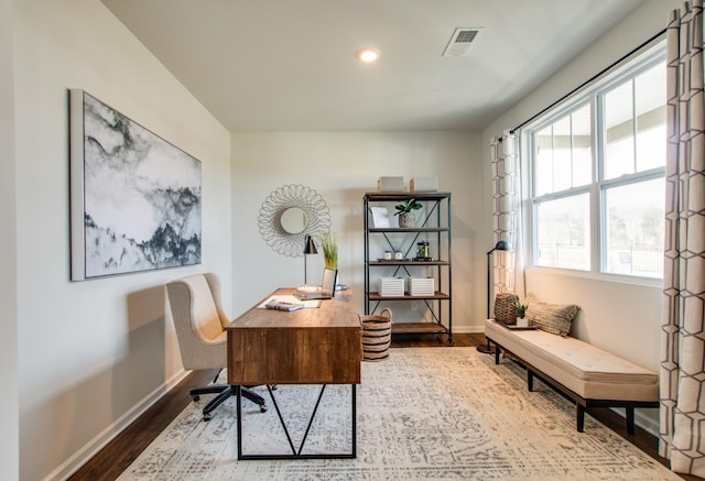 home office with wood-type flooring